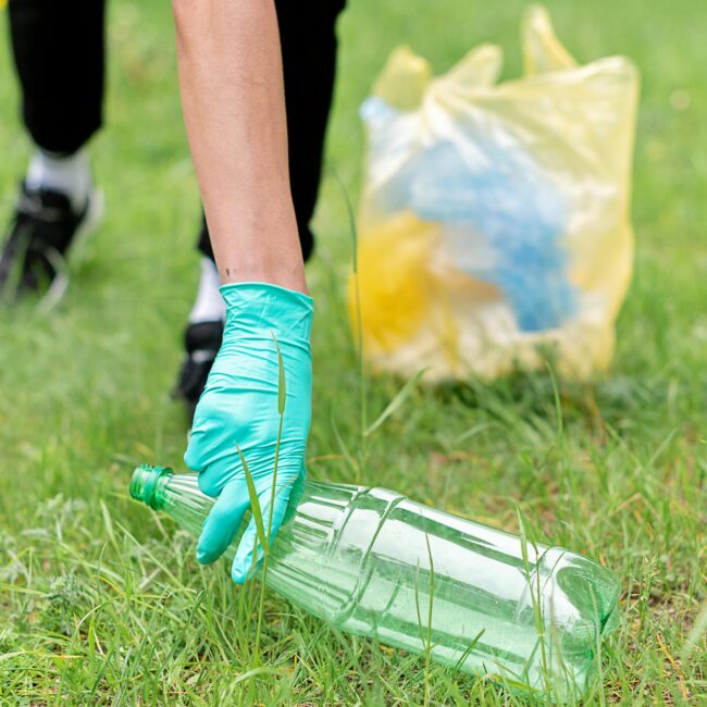 Close up of volunteer litter picking