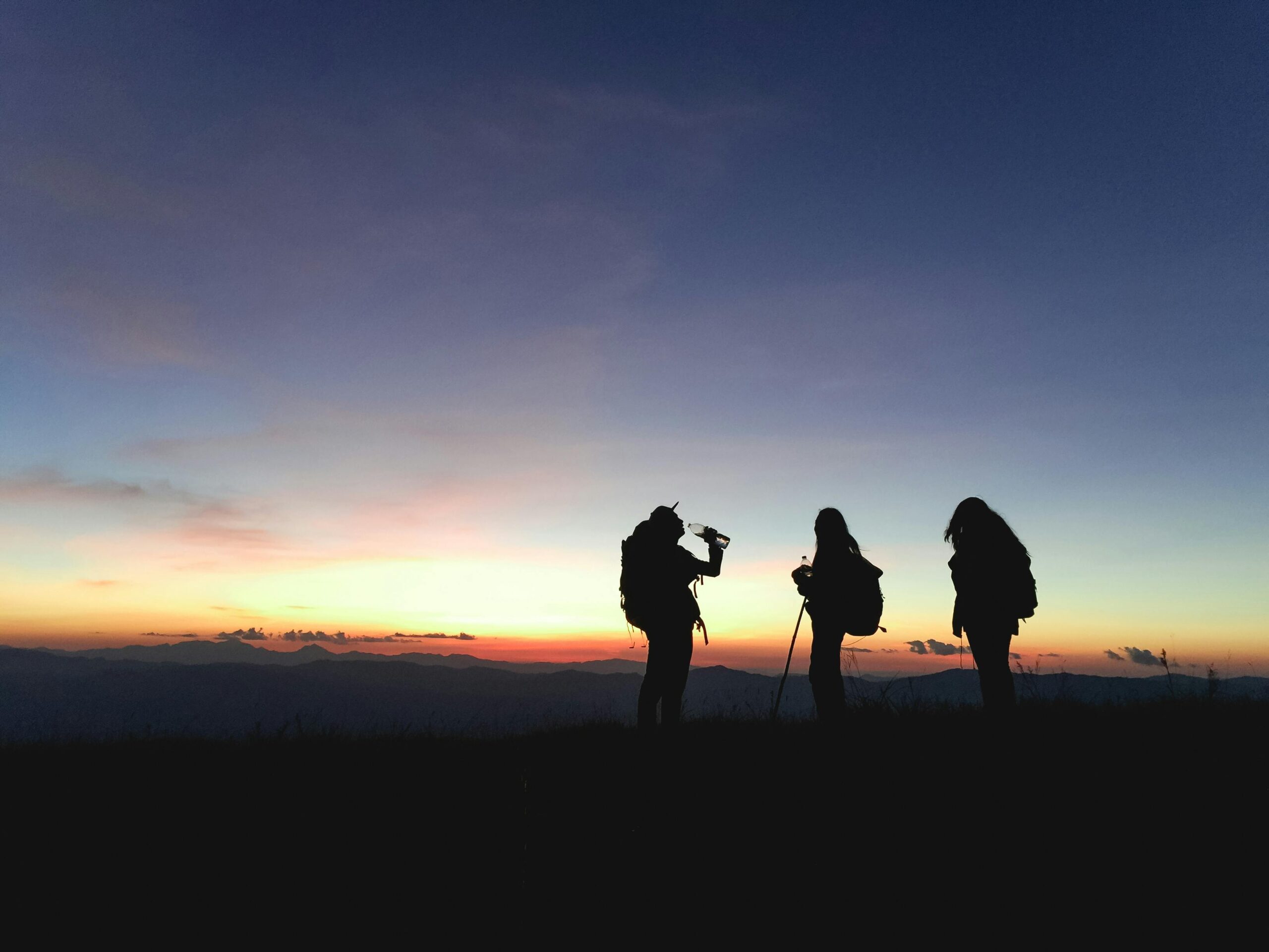 Team summiting Scafell Pike at dusk